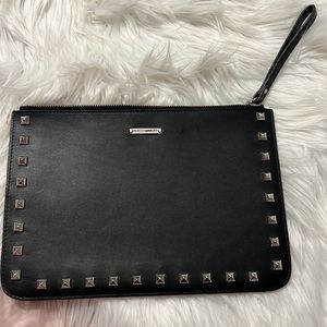 Studded leather clutch. Black leather with silver studs.
